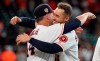 Houston Astros manager AJ Hinch (14) hugs George Springer after Springer's game-ending RBI single against the Los Angeles Angels during the 10th inning of a baseball game Sunday, July 7, 2019, in Houston. The Astros won 11-10. (AP Photo/David J. Phillip)