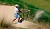 Tiger Woods plays a shot from a bunker on the 17th hole during a practice round at the Dell Match Play Championship golf tournament, Tuesday, March 26, 2019, in Austin, Texas. (AP Photo/Eric Gay)