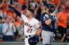Houston Astros' Jose Altuve (27) celebrates after hitting a two-run home rung against the Tampa Bay Rays in the fifth inning during Game 1 in baseball's American League Division Series in Houston, Friday, Oct. 4, 2019. (AP Photo/Michael Wyke)