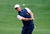 Rory McIlroy chips to the green on the fifth hole during round-robin play at the Dell Technologies Match Play Championship golf tournament, Friday, March 29, 2019, in Austin, Texas. (AP Photo/Eric Gay)