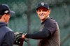New York Yankees manager Aaron Boone, right, takes part in a team workout for a baseball American League Championship Series in Houston, Friday, Oct. 11, 2019. New York will face the Houston Astros, Saturday. (AP Photo/Eric Gay)