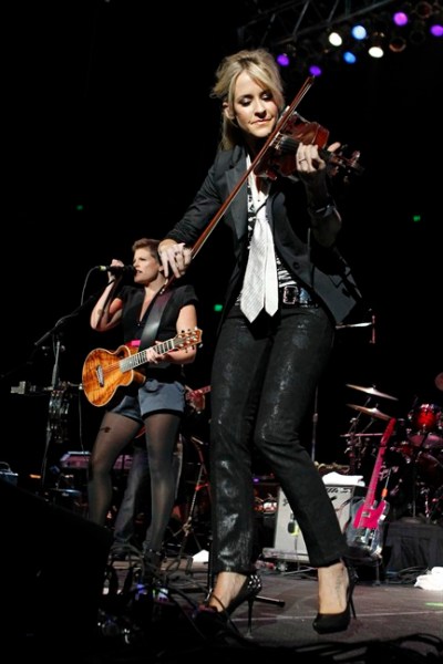 Fiddle player Martie Maguire and lead singer Natalie Maines of the Dixie Chicks perform during the Fire Relief, The Concert For Central Texas at the Frank Erwin Center in Austin, Texas, Monday, Oct. 17, 2011 as part of the all-star lineup of Texas musicians organized to help raise money for victims of the late-summer central Texas wildfires. (AP Photo/Erich Schlegel)