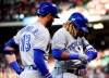 Toronto Blue Jays' Vladimir Guerrero Jr., right, looks at his hand after being hit by a pitch as Lourdes Gurriel Jr. watches during the first inning of a baseball game against the Houston Astros, Friday, June 14, 2019, in Houston. Guerrero, Jr. left the game after the first inning. THE CANADIAN PRESS/AP-Eric Christian Smith