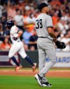 New York Yankees starting pitcher Jonathan Loaisiga, right, walks off the mound as Houston Astros' Jose Altuve, back left, rounds the bases after hitting a solo home run during the third inning of a baseball game, Tuesday, April 9, 2019, in Houston. The home run was Altuve's 100th for his career. (AP Photo/Eric Christian Smith)