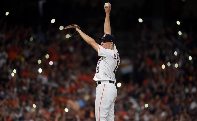 Houston Astros starting pitcher Aaron Sanchez stretches on the mound during the sixth inning of the team's baseball game against the Seattle Mariners, Saturday, Aug. 3, 2019, in Houston. (AP Photo/Eric Christian Smith)