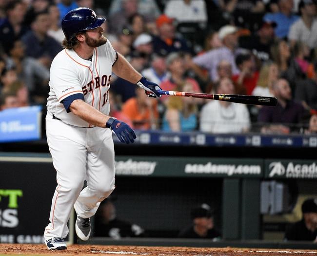 Houston Astros' Tyler White watches his solo home run off Chicago White Sox relief pitcher Jose Ruiz during the fourth inning of a baseball game, Monday, May 20, 2019, in Houston. (AP Photo/Eric Christian Smith)