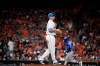 Houston Astros starting pitcher Brad Peacock, left, walks off the mound as Toronto Blue Jays' Lourdes Gurriel Jr., back right, rounds the bases after hitting a two-run home run during the fifth inning of a baseball game, Sunday, June 16, 2019, in Houston. (AP Photo/Eric Christian Smith)