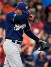 Milwaukee Brewers starting pitcher Freddy Peralta wipes his brow while walking back to the mound after giving up an RBI triple to Houston Astros' Michael Brantley during the fifth inning of a baseball game, Tuesday, June 11, 2019, in Houston. (AP Photo/Eric Christian Smith)