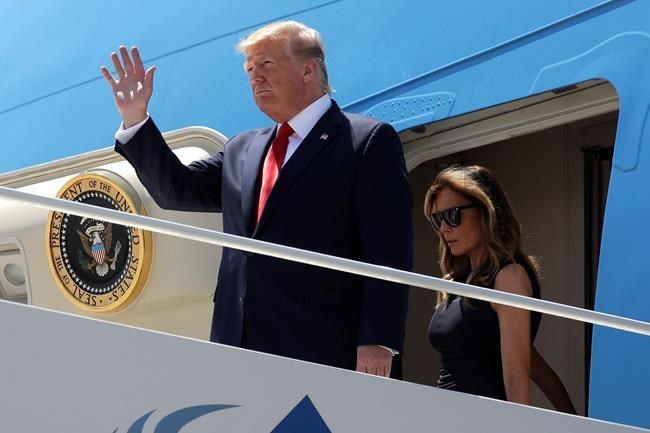 President Donald Trump and first lady Melania Trump arrive at El Paso International Airport to meet with people affected by the El Paso mass shooting, Wednesday, Aug. 7, 2019, in El Paso, Texas. (AP Photo/Evan Vucci)