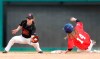 Maycen Gibbs (14), of Folsom, Calf., steals second base against Rebecca Priscilla Stern, of Cabin John, Md., during a baseball game in Arlington, Texas, Friday, March 8, 2019. More than 60 high school girls from the United States, as well as Canada and Puerto Rico are taking part in the inaugural MLB Grit event, a tournament specifically for girls who play baseball. (AP Photo/LM Otero)