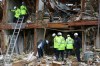 Firefighter conduct a search and rescue operation at an apartment destroyed by an explosion at a fertilizer plant in West, Texas, Thursday, April 18, 2013. A massive explosion at the plant killed as many as 15 people and injured more than 160, officials said overnight. (AP Photo/LM Otero)