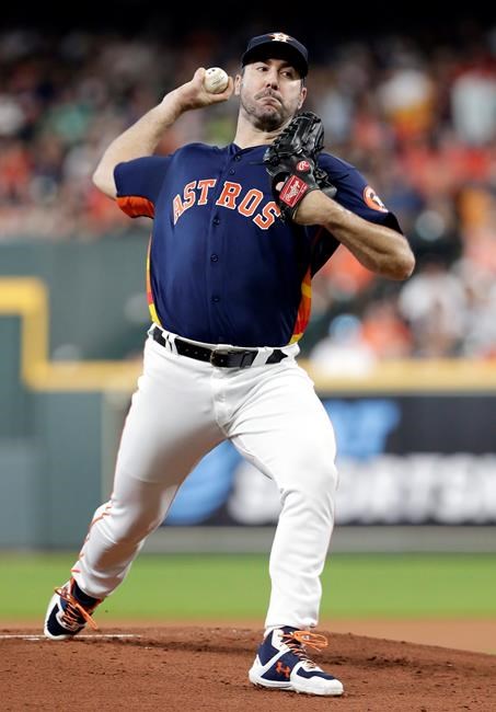 Houston Astros starting pitcher Justin Verlander throws during the first inning of a baseball game against the Seattle Mariners, Sunday, Aug. 4, 2019, in Houston. (AP Photo/Michael Wyke)