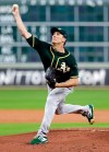 Oakland Athletics starting pitcher Homer Bailey throws against the Houston Astros during the first inning of a baseball game Thursday, Sept. 12, 2019, in Houston. (AP Photo/Michael Wyke)