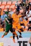 Portland Timbers defender Bill Tuiloma (25) and Houston Dynamo forward Alberth Elis (17) both go up for a head ball during the first half of an MLS soccer match Wednesday, May 15, 2019, in Houston. (AP Photo/Michael Wyke)