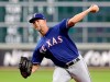 Texas Rangers starting pitcher Mike Minor throws during the first inning of the team's baseball game against the Houston Astros on Friday, July 19, 2019, in Houston. (AP Photo/Michael Wyke)
