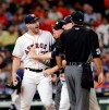 Houston Astros starting pitcher Justin Verlander, left, is held back by first base umpire Greg Gibson and manager A.J. Hinch as Verlander argues with home plate umpire Pat Hoberg after he ejected Verlander during the sixth inning of a baseball game against the Tampa Bay Rays Tuesday, Aug. 27, 2019, in Houston. (AP Photo/Michael Wyke)
