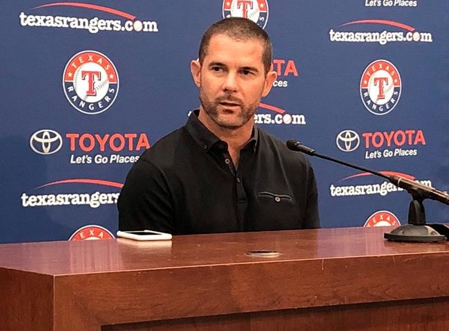 Former Texas Rangers player Michael Young responds to questions during a news conference in Arlington, Texas, Tuesday, June 18, 2019. The Rangers announced Tuesday that the team will retire Young's jersey number during a ceremony scheduled for Aug. 31, before a game against the Seattle Mariners (AP Photo/Stephen Hawkins)