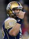 Winnipeg Blue Bombers' quarterback Brian Brohm (12) signals to his players during the second half of CFL action against the Hamilton Tiger-Cats in Winnipeg Friday. (John Woods / The Canadian Press)