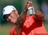 DAVE MARTIN / THE ASSOCIATED PRESS
Tiger Woods hits his approach shot to the 16th hole Friday at the East Lake Golf Club in Atlanta. He put it to four feet then missed the birdie putt.