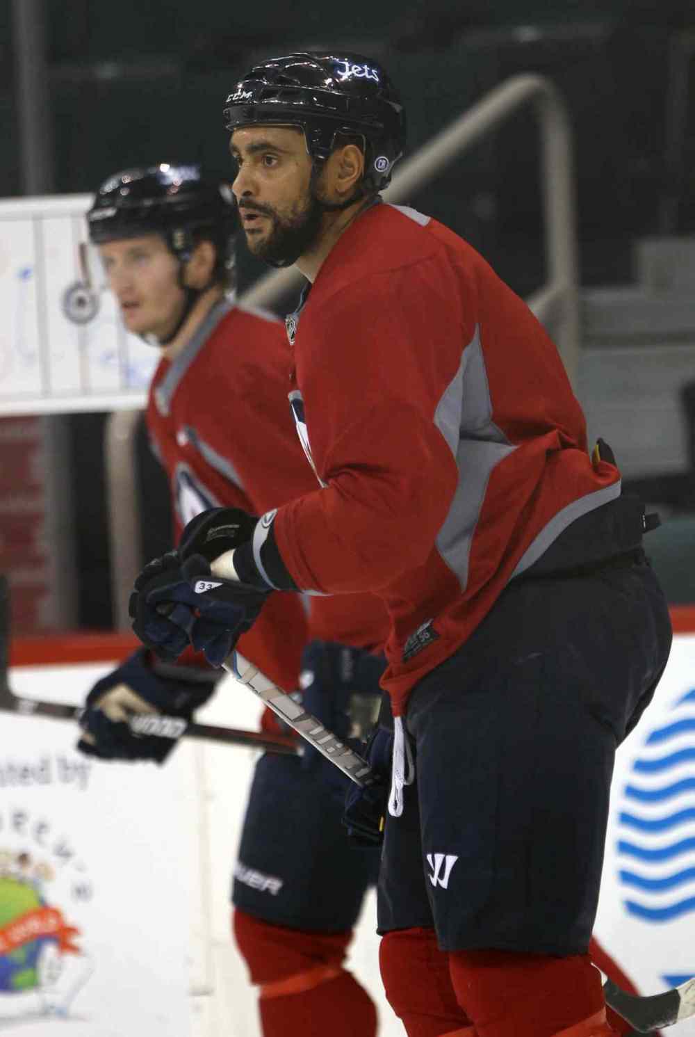 JOE BRYKSA / WINNIPEG FREE PRESS
Dustin Byfuglien, front, and Jacob Trouba were working together on same line at practice again this morning.
