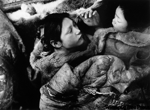Richard Harrington
Two girls asleep under caribou skins during the famine in 1950, Padlei, NWT.