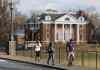 Steve Helber / The Associated Press
University of Virginia students walk to campus past the Phi Kappa Psi fraternity house at the University of Virginia in Charlottesville, Va.  The university has suspended activities at all campus fraternal organizations amid an investigation into a published report in which a student described being sexually assaulted by seven men in 2012 at the Phi Kappa Psi house.