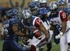 JOE BRYKSA / WINNIPEG FREE PRESS
Winnipeg Blue Bombers Matt Bucknor, left, wrestles for the ball along with Montreal Alouettes Brandon London, centre, and Kenny Stafford during first half CFL action at Investors Group Field in Winnipeg Friday night.
