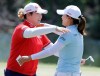 Jin Young Ko, right, of South Korea, hugs Ariya Jutanugarn, of Thailand, during the third round of the LPGA Tour golf tournament at Kingsmill Resort in Williamsburg, Va., Saturday, May 25, 2019. (AP Photo/Steve Helber)