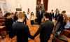In this Feb. 5, 2019, photo, a group of students from the Teenpact Leadership school pray in front of the statue of Confederate General Robert E. Lee in the old House chambers at the Capitol in Richmond, Va. Virginia has come a long way from its days as a bastion of slavery and white supremacy. But when a racist photo was discovered last week on Gov. Ralph Northam‚Äôs 1984 medical school yearbook page, it exposed how much deeply embedded racism still lurks in the state. (AP Photo/Steve Helber)