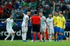 Argentine players complain to referee Roddy Zambrano during a Copa America semifinal soccer match at Mineirao stadium in Belo Horizonte, Brazil, Tuesday, July 2, 2019. (AP Photo/Victor R. Caivano)