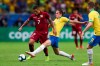 Brazil's Filipe Luis, center, vies for the ball with Venezuela's Darwin Machis, left, during a Copa America Group A soccer match at the Arena Fonte Nova in Salvador, Brazil, Tuesday, June 18, 2019. (AP Photo/Natacha Pisarenko)