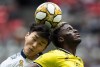 Vancouver Whitecaps' Inbeom Hwang, left, and Columbus Crew's Gyasi Zardes vie for the ball during the first half of an MLS soccer game in Vancouver on Saturday, Sept. 21, 2019. THE CANADIAN PRESS/Darryl Dyck