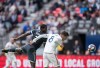 Real Salt Lake's Damir Kreilach (8) gets his head on the ball and scores a goal as Vancouver Whitecaps' Doneil Henry (2) defends during the first half of an MLS soccer game in Vancouver, on Sunday October 6, 2019. THE CANADIAN PRESS/Darryl Dyck