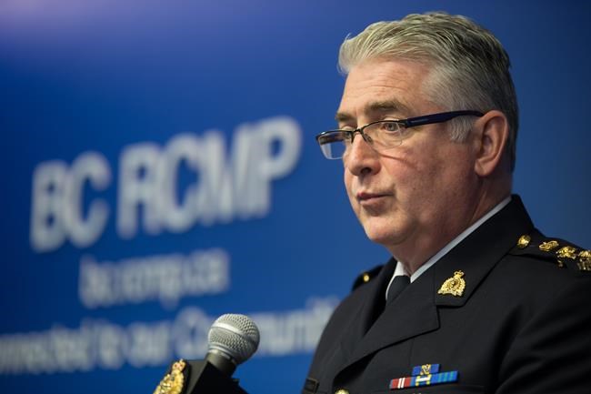 RCMP Asst. Comm. Kevin Hackett, who oversees the RCMP's federal organized crime investigations in B.C., reads a statement about Bryer Schmegelsky and Kam McLeod and the homicides of three people in northern B.C., during a news conference in Surrey, B.C., Friday, Sept. 27, 2019. THE CANADIAN PRESS/Darryl Dyck