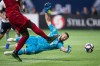 Vancouver Whitecaps goalkeeper Maxime Crepeau, back, allows a goal to Toronto FC's Nick DeLeon during the second half of an MLS soccer game in Vancouver on Friday May 31, 2019. THE CANADIAN PRESS/Darryl Dyck