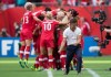 Canada coach John Herdman, right, celebrates as Josee Belanger, back, is mobbed by her teammates after scoring against Switzerland during the second half of the FIFA Women's World Cup round of 16 soccer action in Vancouver, B.C., on Sunday, June 21, 2015. THE CANADIAN PRESS/Darryl Dyck