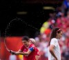 Canada's Christine Sinclair, left, sprays water in celebration as Switzerland's Rahel Kiwic, right, leaves the field after Canada defeated Switzerland 1-0 in the FIFA Women's World Cup round of 16 soccer action in Vancouver, B.C., on Sunday, June 21, 2015. THE CANADIAN PRESS/Darryl Dyck