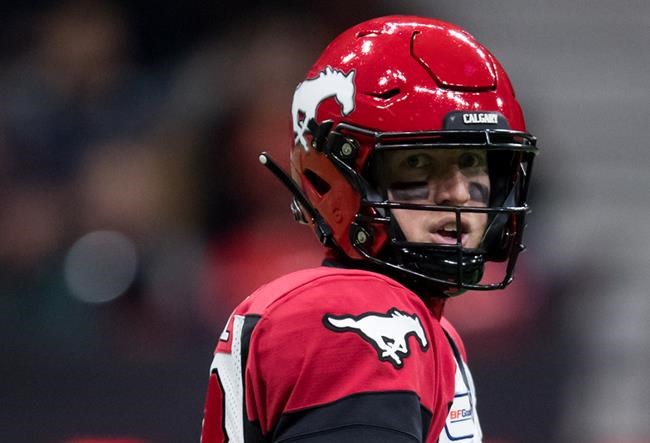 Calgary Stampeders quarterback Bo Levi Mitchell looks on during first half CFL football action against the B.C. Lions, in Vancouver, Saturday, Nov. 2, 2019. The road to a fourth straight Grey Cup title will be a little longer than usual for Mitchell and the Stampeders. THE CANADIAN PRESS/Darryl Dyck