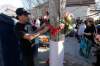 John Woods / Winnipeg Free Press
A man places a flower at a vigil on Tuesday for Carolyn Marie Sinclair and her unborn baby who were found slain and dumped in a lane behind the 700 block of Notre Dame Avenue on Saturday.