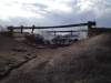 KEN GIGLIOTTI / WINNIPEG FREE PRESS
A bridge just east of Vita collapsed after catching fire. Two wrecked cars were still smoking Wednesday morning after Tuesday's wild fire that destroyed the bridge.