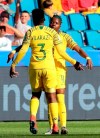 South Africa's Bambanani Mbane, left, congratulates teammate South Africa's Thembi Kgatlana after she scored the matchs first goal during the Women's World Cup Group B soccer match between Spain and South Africa at the Stade Oceane in Le Havre, France, Saturday, June 8, 2019. (AP Photo/Francisco Seco)