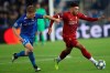 Liverpool's Alex Oxlade-Chamberlain, right, is pursued by Genk's Jere Uronen during a Champions League group E soccer match between Genk and Liverpool at the KRC Genk Arena in Genk, Belgium, Wednesday, Oct. 23, 2019. (AP Photo/Francisco Seco)