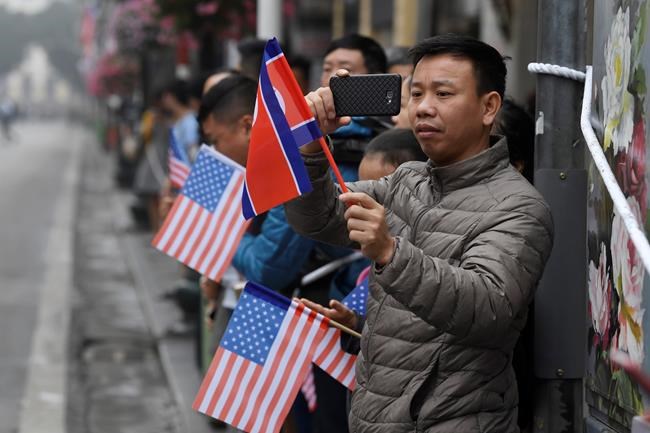 People gather along the streets in hopes of seeing a motorcade for North Korean leader Kim Jong Un or President Donald Trump pass by in Hanoi, Vietnam, Thursday, Feb. 28, 2019. Kim and Trump are meeting for a second day in Hanoi for their second summit. (AP Photo/Susan Walsh)