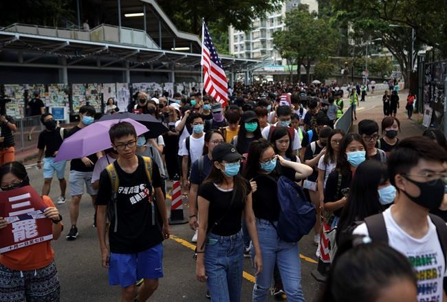 Students march to the Chinese University to show support to those students who were arrested by police in Hong Kong, Thursday, Oct.3, 2019. (AP Photo/Vincent Thian)