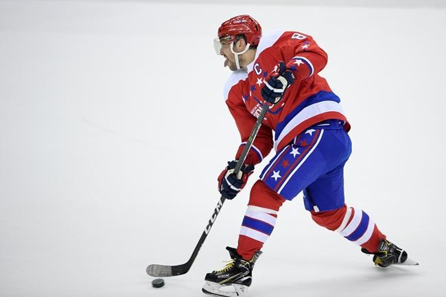 Washington Capitals left wing Alex Ovechkin (8), of Russia, passes the puck during the third period of an NHL hockey game against the New York Islanders, Saturday, April 6, 2019, in Washington. The Islanders won 3-0. (AP Photo/Nick Wass)