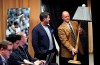 Former Seattle Mariners designated hitter Edgar Martinez, center, watches as Tim Hevly, Mariners vice president of communications, brings in a 