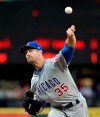 Chicago Cubs starting pitcher Cole Hamels throws to a Seattle Mariners batter during the first inning of a baseball game Tuesday, April 30, 2019, in Seattle. (AP Photo/Elaine Thompson)