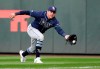 Tampa Bay Rays right fielder Avisail Garcia lunges to snag a sacrifice fly ball from Seattle Mariners' Tim Lopes that scored a run during the second inning of a baseball game Saturday, Aug. 10, 2019, in Seattle. (AP Photo/Elaine Thompson)