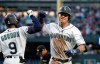 Seattle Mariners' Dylan Moore, right, is congratulated by Dee Gordon on his solo home run against the St. Louis Cardinals during the fifth inning of a baseball game Wednesday, July 3, 2019, in Seattle. (AP Photo/Elaine Thompson)