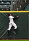 CORRECT STHAT HOME RUN WAS BY JORGE SOLER IN THE THIRD INNING - Seattle Mariners center fielder Mallex Smith leaps at the wall but is unable to catch a home run by Kansas City Royals' Jorge Soler during the third inning of a baseball game Tuesday, June 18, 2019, in Seattle. (AP Photo/Elaine Thompson)